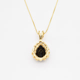 Bold Onyx Pendant Necklace serves as a luxurious statement piece.