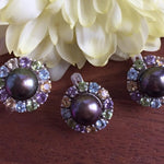 Natural Black Pearl ring encircled by multicolor gemstones, adding luxury to special occasion outfits