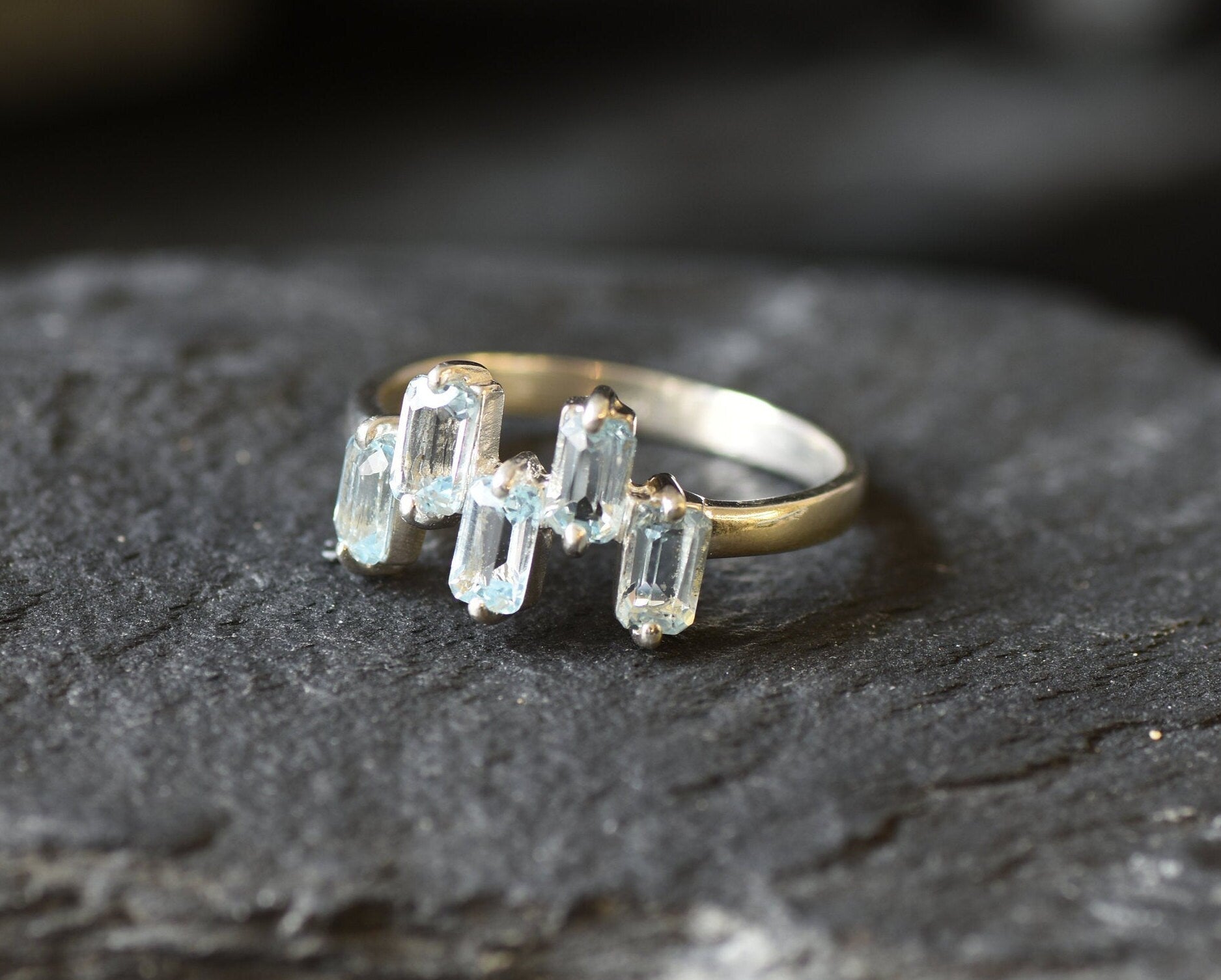 A modern topaz ring for stylish nights out or birthstone lovers.