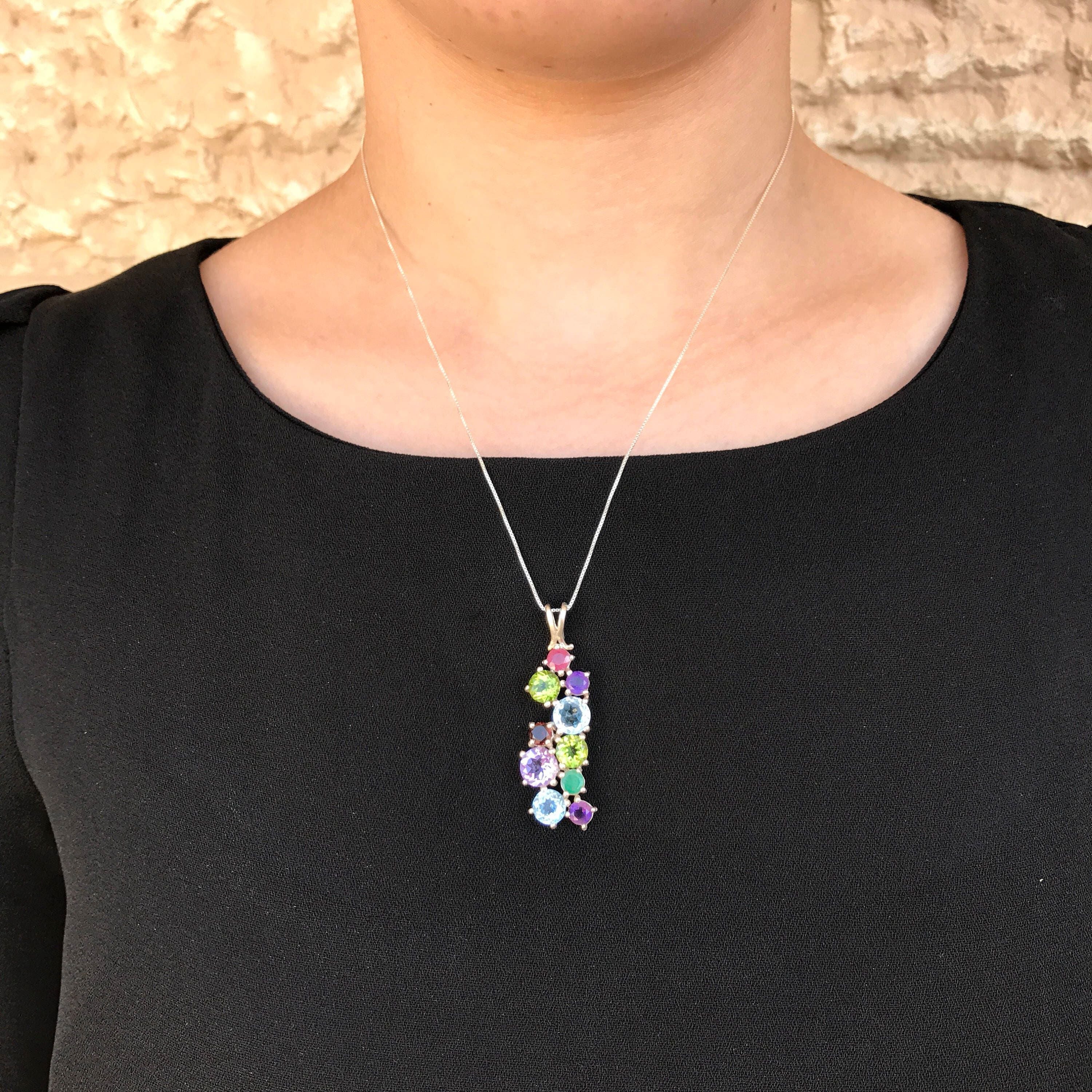 Elegant Emerald Pendant in 925 Sterling Silver, showcasing a stunning green gem, a meaningful gift for May birthdays and special occasions.