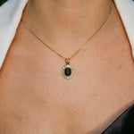 Woman wearing natural onyx pendant necklace paired with white shirt highlighting vintage design