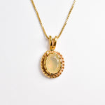 Solitaire Natural Opal Necklace crafted in 18k yellow gold vermeil over solid 925 sterling silver, in oval cut, and prong setting. Vintage Opal Pendant ideal for special occasions, for layering necklaces or wearing solo. October birthstone stimulates imagination and love.