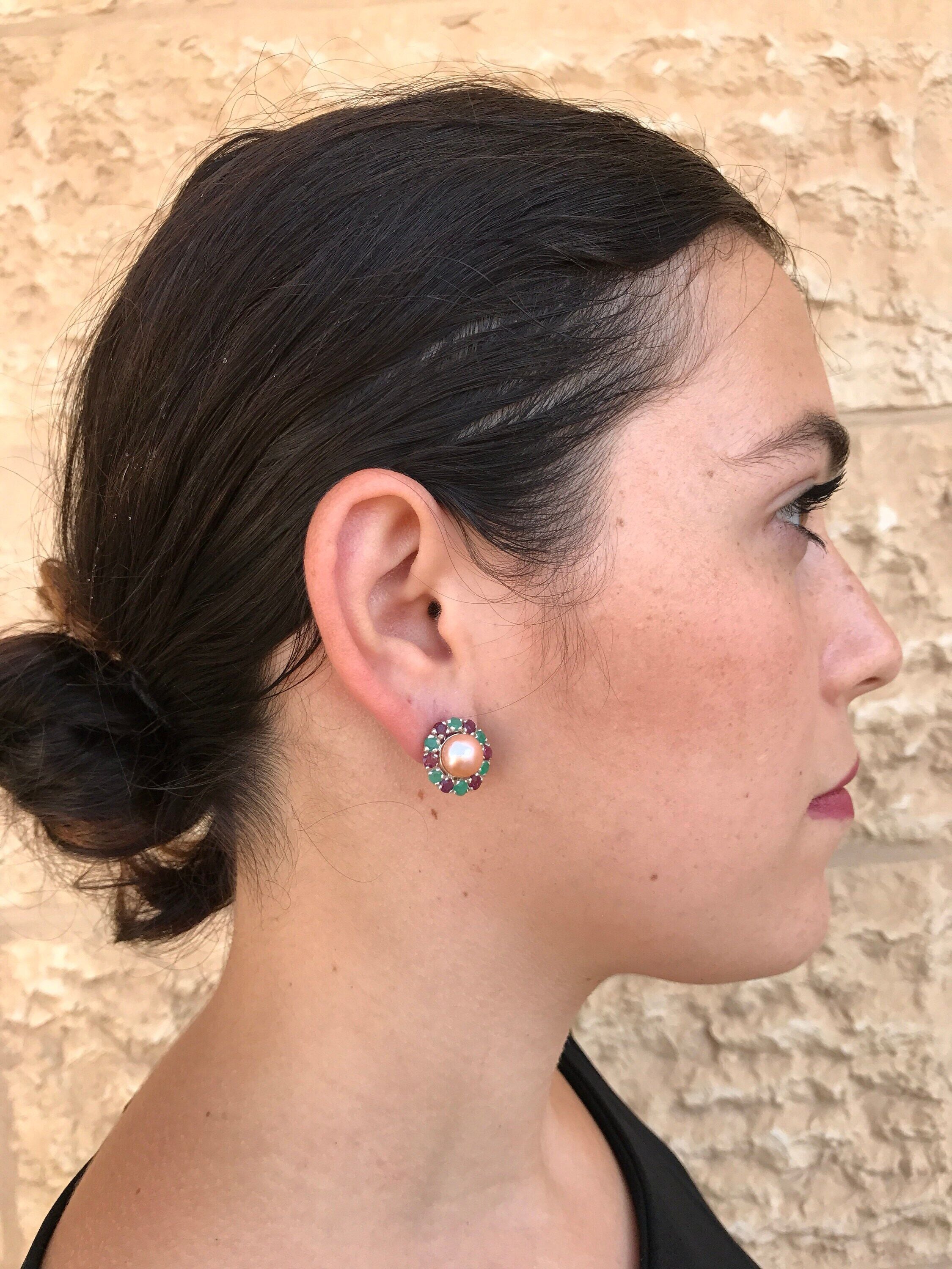 Natural Pearl earrings with multicolored gems complementing a pulled-back hairstyle and simple black top, blending classic jewelry with contemporary style.