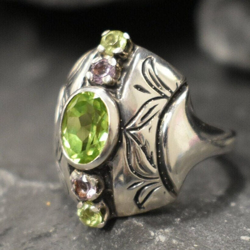 Natural Peridot & Amethyst ring in sterling silver with floral accents, elegant for daily wear and gemstone lovers.