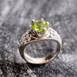 Natural Peridot elegant ring in sterling silver, representing strength and joy, suitable for engagements or daily wear.