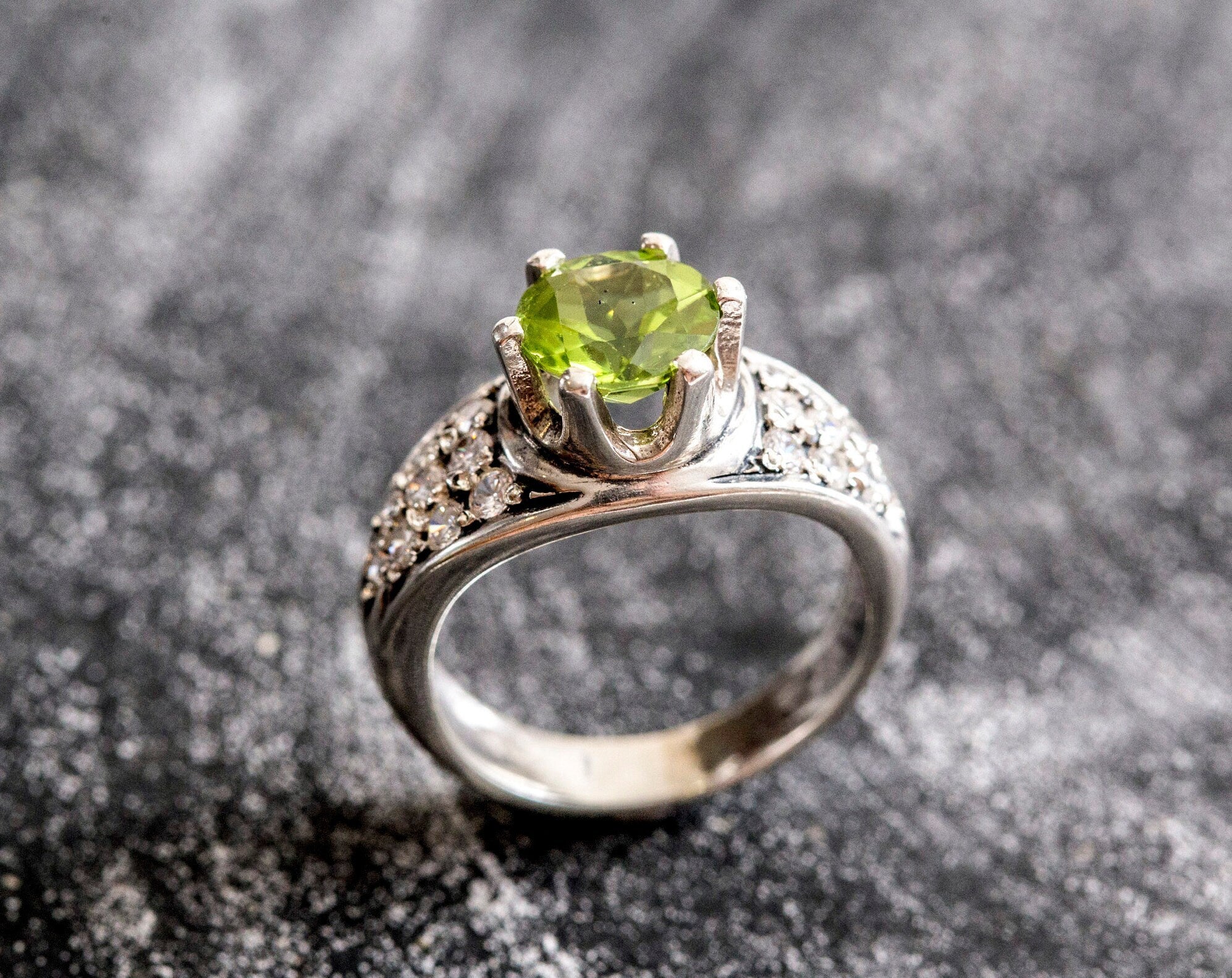 Natural Peridot elegant ring in sterling silver, representing strength and joy, suitable for engagements or daily wear.