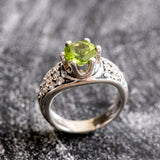 Natural Peridot elegant ring in sterling silver, representing strength and joy, suitable for engagements or daily wear.