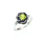 Natural Peridot ring in floral setting, adds vintage elegance, perfect August birthstone gift and nature-inspired accessory.