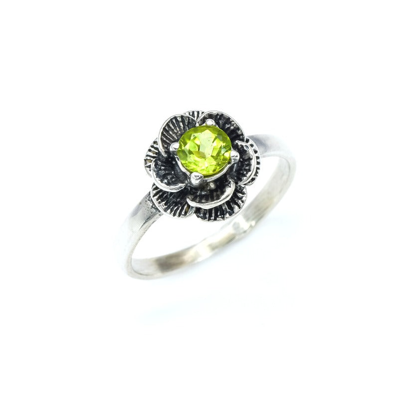 Natural Peridot ring in floral setting, adds vintage elegance, perfect August birthstone gift and nature-inspired accessory.