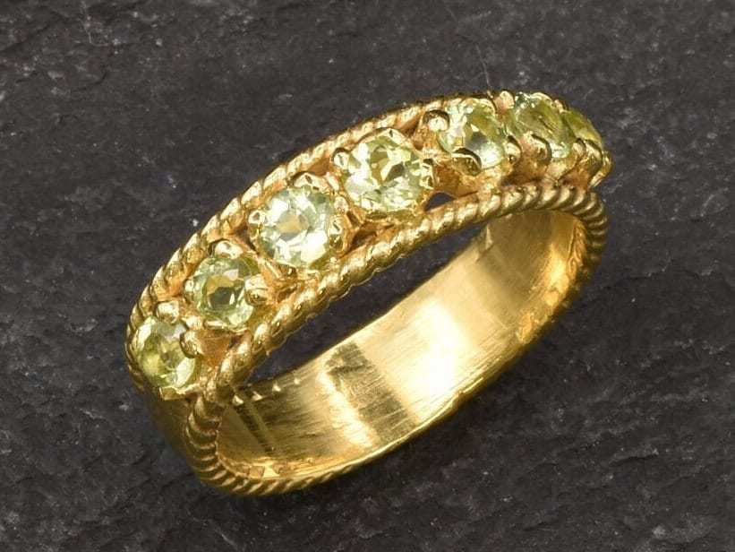 Natural Peridot Band Ring in gold vermeil with floral-inspired bezel setting, perfect for stacking or gifting.