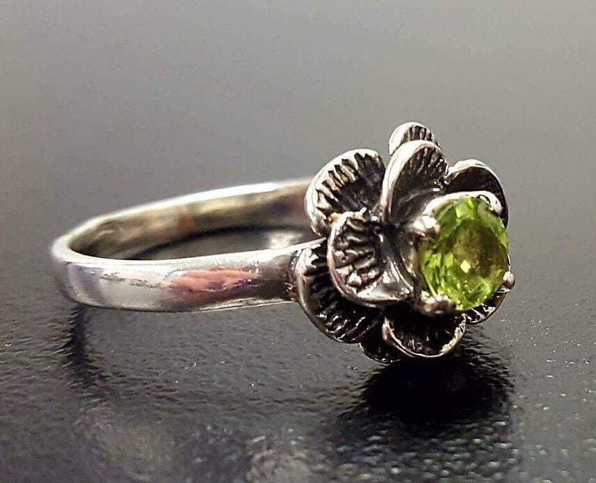 Natural Peridot gemstone ring, symbol of clarity and growth, a heartfelt birthday or wellness gift.