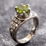 Natural Peridot ring with CZ diamond accents in sterling silver, symbolizing growth and renewal, perfect for engagements.