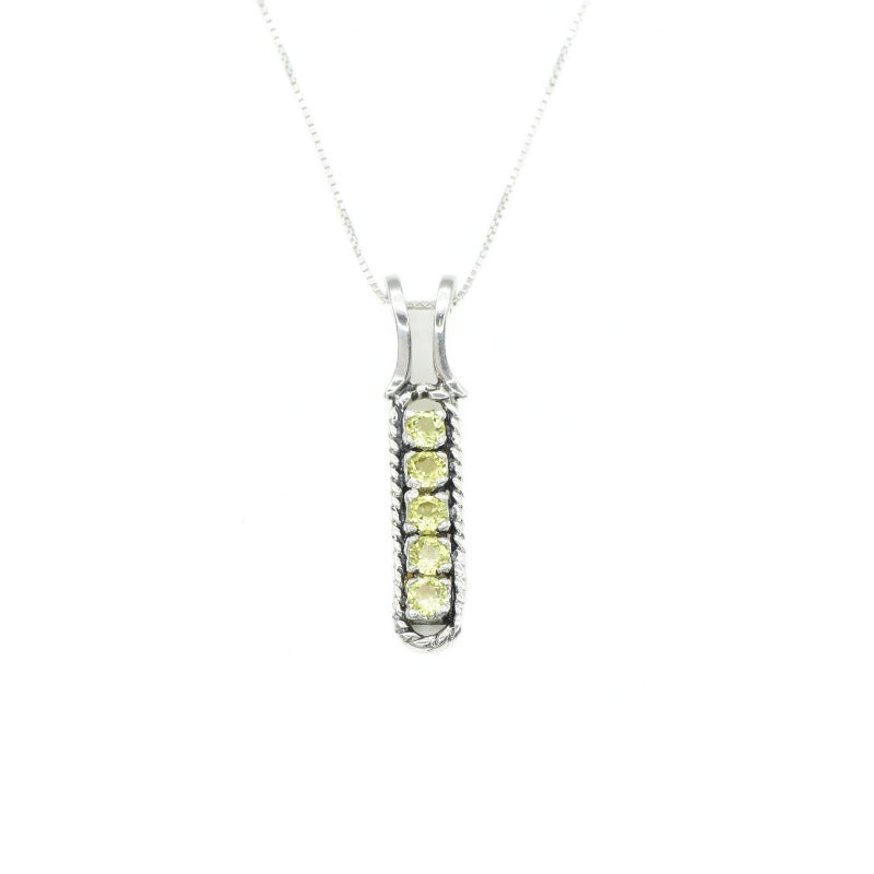 Natural Peridot bar necklace in sterling silver, styled as a minimalist jewelry piece with calming energy benefits, perfect for August birthdays and nature-inspired gifting.