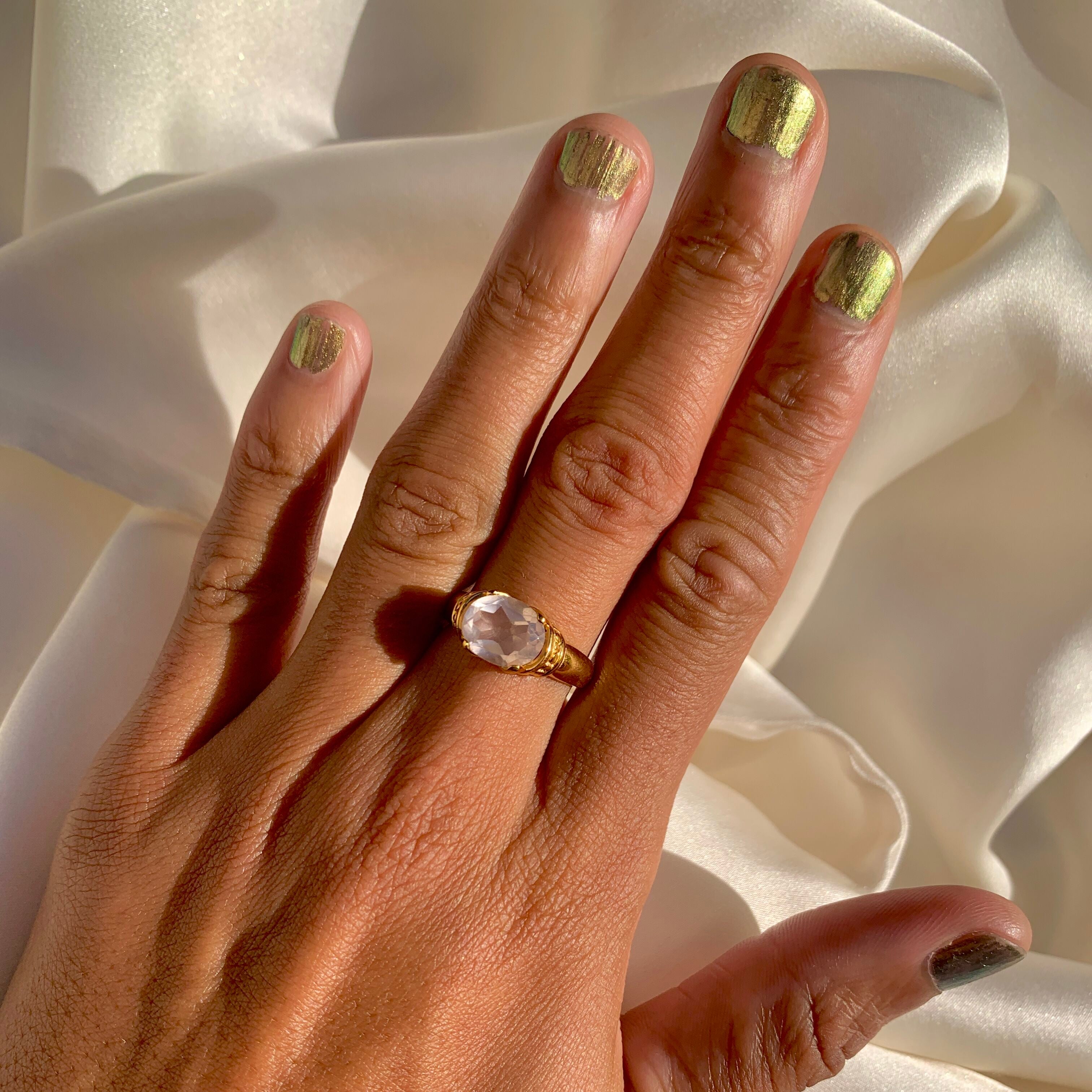 Natural Rose Quartz Ring set in 18k gold vermeil over solid 925 sterling silver, pink solitaire ring worn in middle finger for size reference.