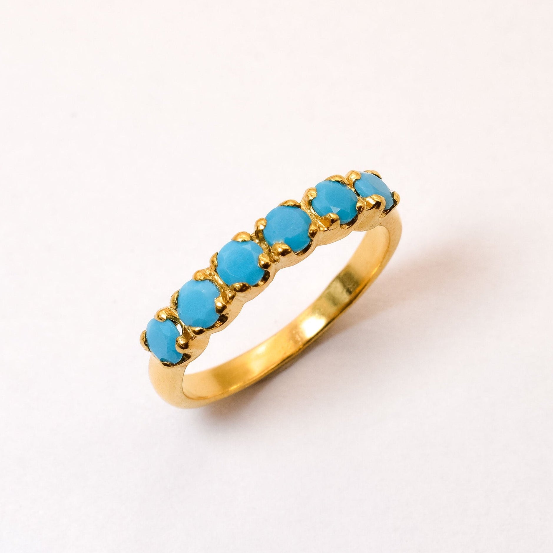 Half Eternity Turquoise Ring in 18k Yellow Gold over Solid 925 Sterling Silver, in a prong setting. December birthstone ring offers luck and grounding. Blue stackable band perfect for everyday wear, and an ideal birthday present.