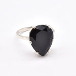 Onyx Ring in silver blends bold elegance with refined simplicity.