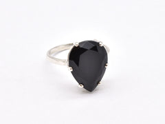 Onyx Ring in silver blends bold elegance with refined simplicity.