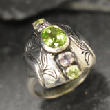 Detailed sterling silver ring featuring Peridot & Amethyst gemstones, adding sophistication to formal or casual looks.
