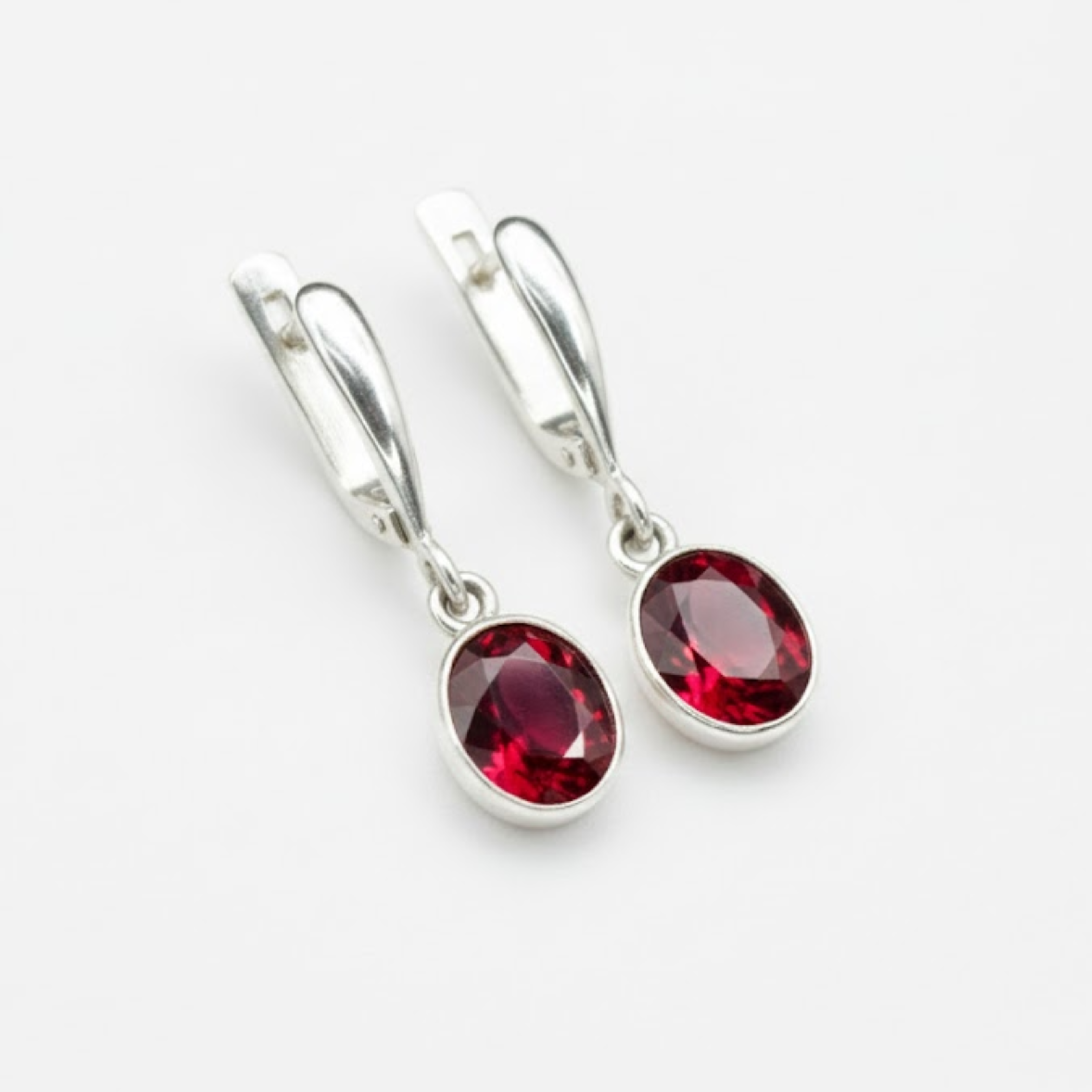 Created Ruby Earrings made in 925 Sterling Silver with Oval Created Red Ruby in Bezel setting, July Birthstone gift idea, symbolizes nobility, purity, and passion, ideal for everyday wear and perfect for birthday gifting and special occasions.