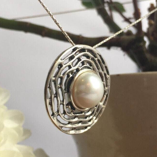 Natural Pearl pendant perfect for classic jewelry fans, known to bring tranquility and intuition, cherished as a bridal heirloom or birthday keepsake.