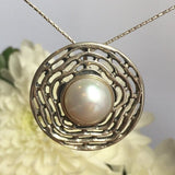 Artistic Natural Pearl necklace shown over a soft floral background, represents purity and harmony, suitable for formal occasions or heartfelt gifting.