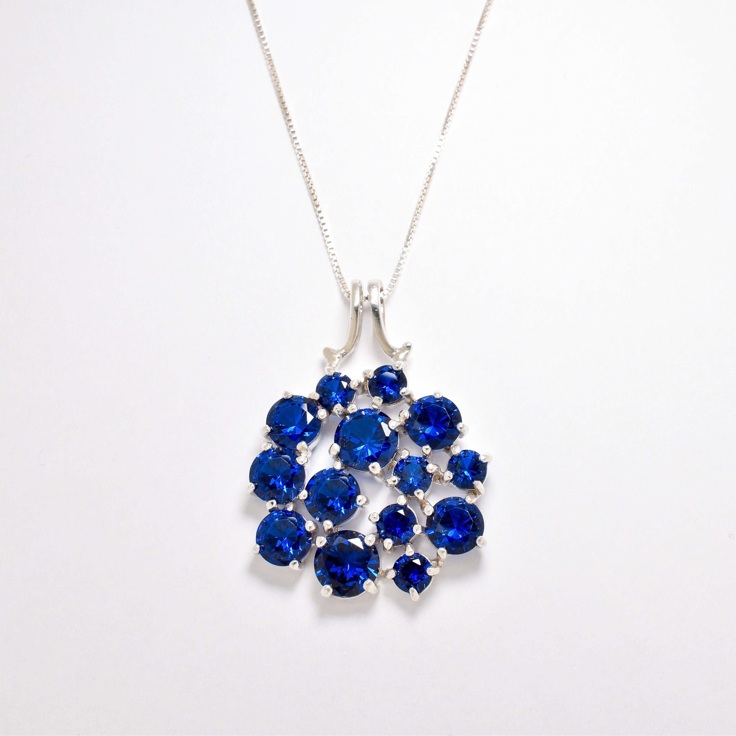Cluster Sapphire Necklace - Blue Statement Necklace - Large Flower Pendant made in Sterling Silver. Ideal for everyday wear and perfect for birthday gifting and special occasions.