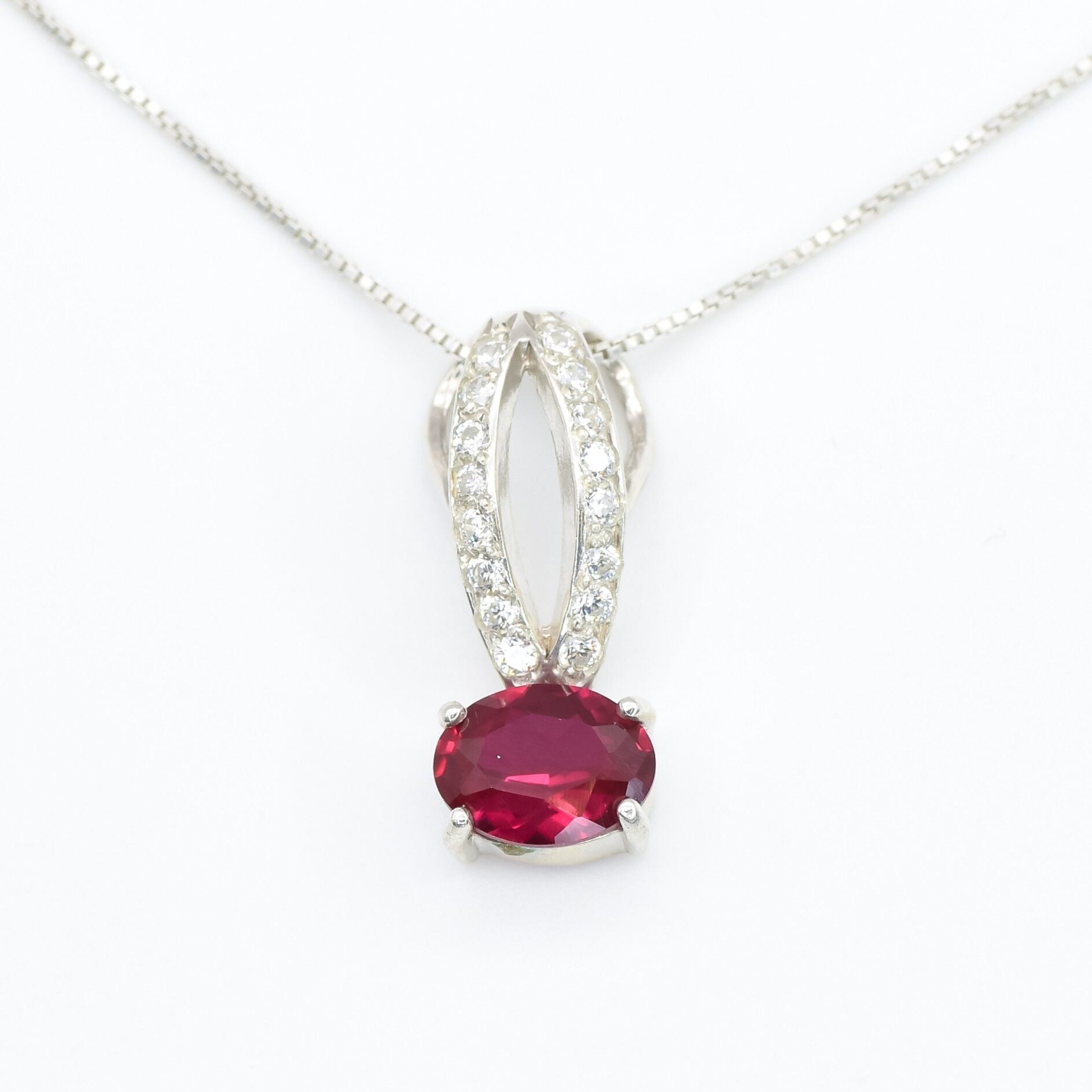 Created Ruby Pendant made in 925 Sterling Silver with Oval Created Red Ruby in Solitaire with Accents setting, July Birthstone gift idea, symbolizes nobility, purity, and passion, ideal for everyday wear and perfect for birthday gifting and special occasions.