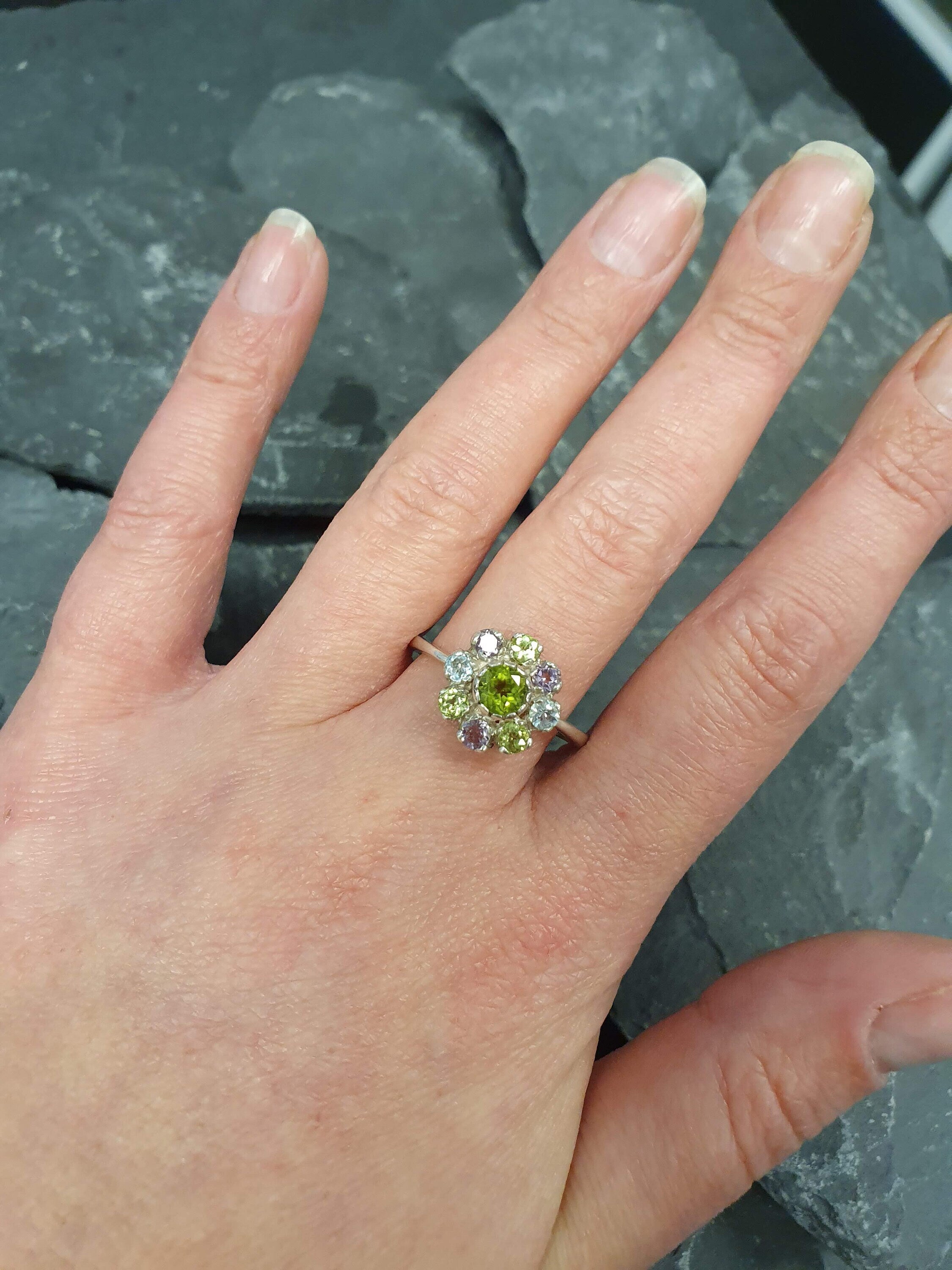 Peridot cluster gemstone ring with Blue Topaz and Amethyst, perfect as a thoughtful jewelry gift.