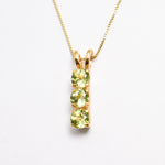 Gold Peridot Necklace Front View in White Background