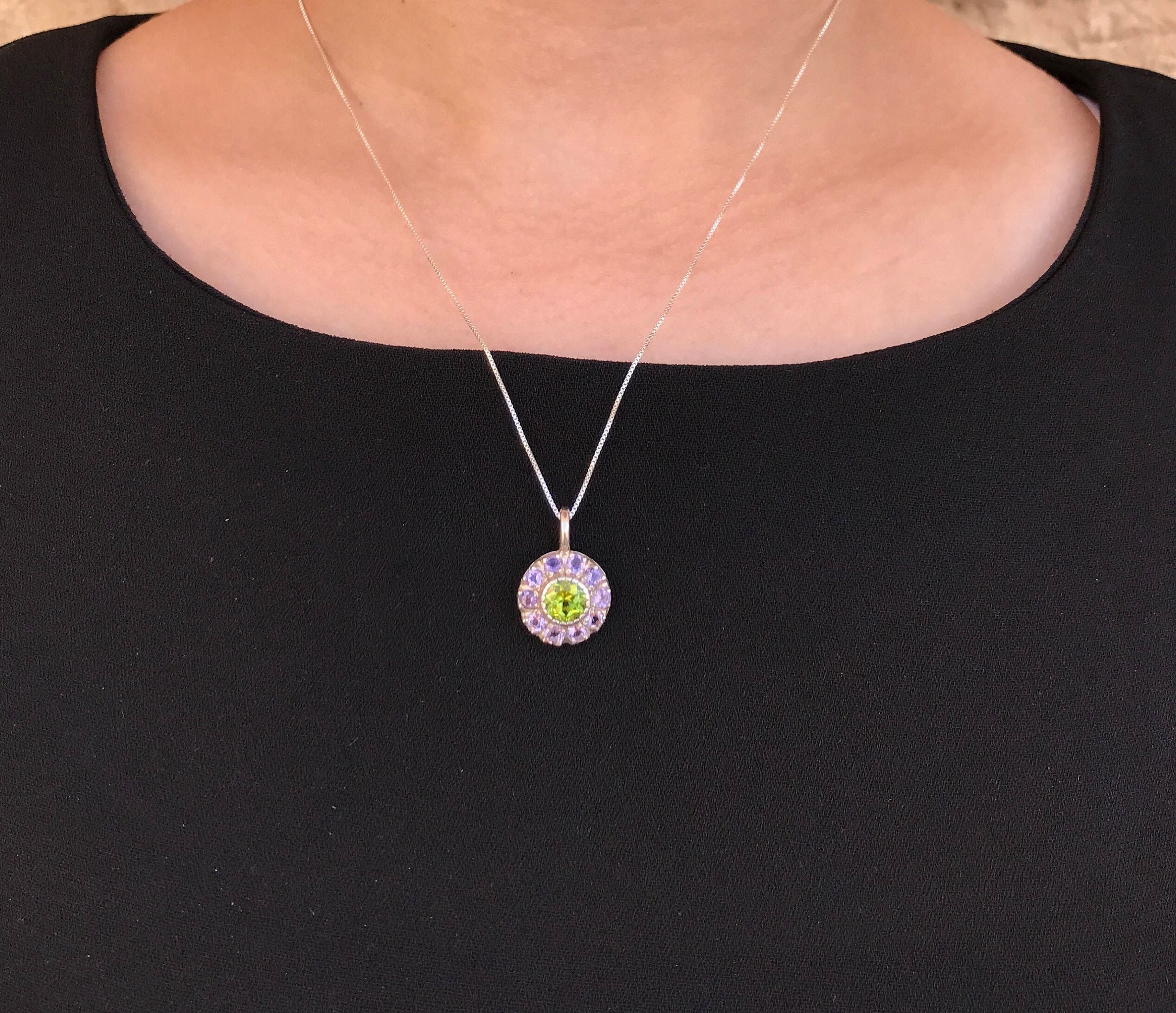 Peridot Pendant Necklace styled with a black dress, letting the green gemstone pop with contrast—ideal for elevating minimal evening outfits or formal wear.