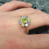 Peridot ring worn on hand with natural nails, creating a fresh and casual gemstone jewelry look.