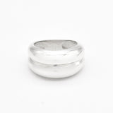 Flat lay image of a polished solid 925 sterling silver band ring on a white background.