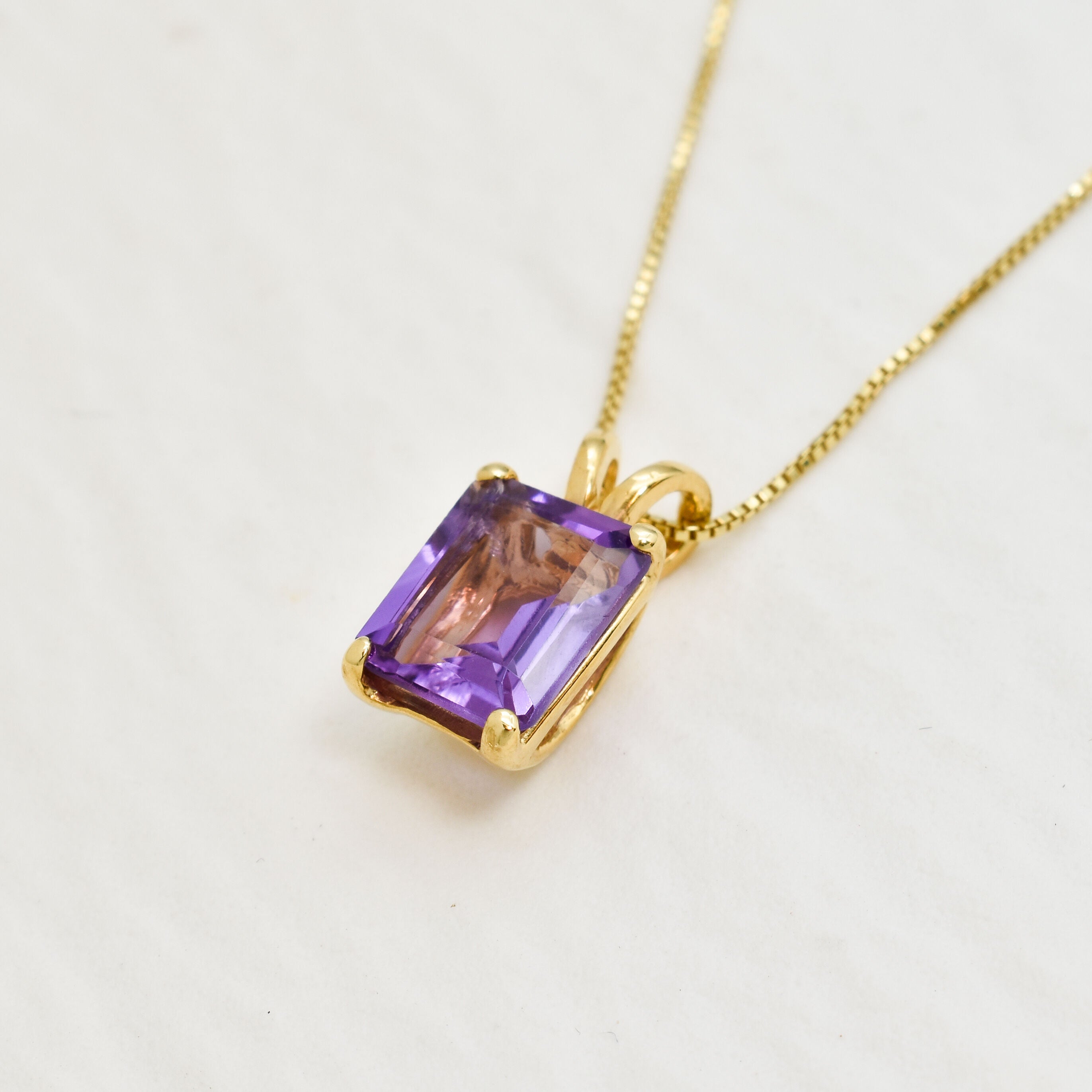 Yellow gold plated necklace with Amethyst February birthstone in radiant cut and prong setting. Square Gemstone necklace ideal for special occasions and anniversary present. Encourages calmness, spiritual growth, and emotional balance.
For peace, clarity, intuition