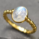 Rainbow Moonstone ring known for spiritual depth, worn for lunar energy and protection, ideal for gifting to empaths or spiritual seekers.