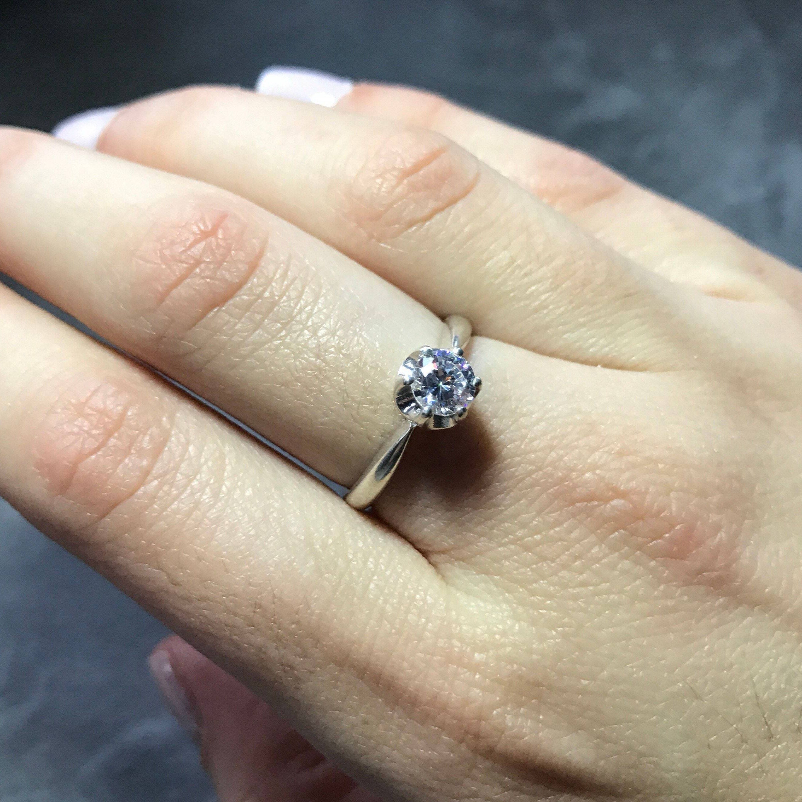 Round-cut Rainbow Moonstone ring for chic and graceful style. Lovely when worn solo or paired.