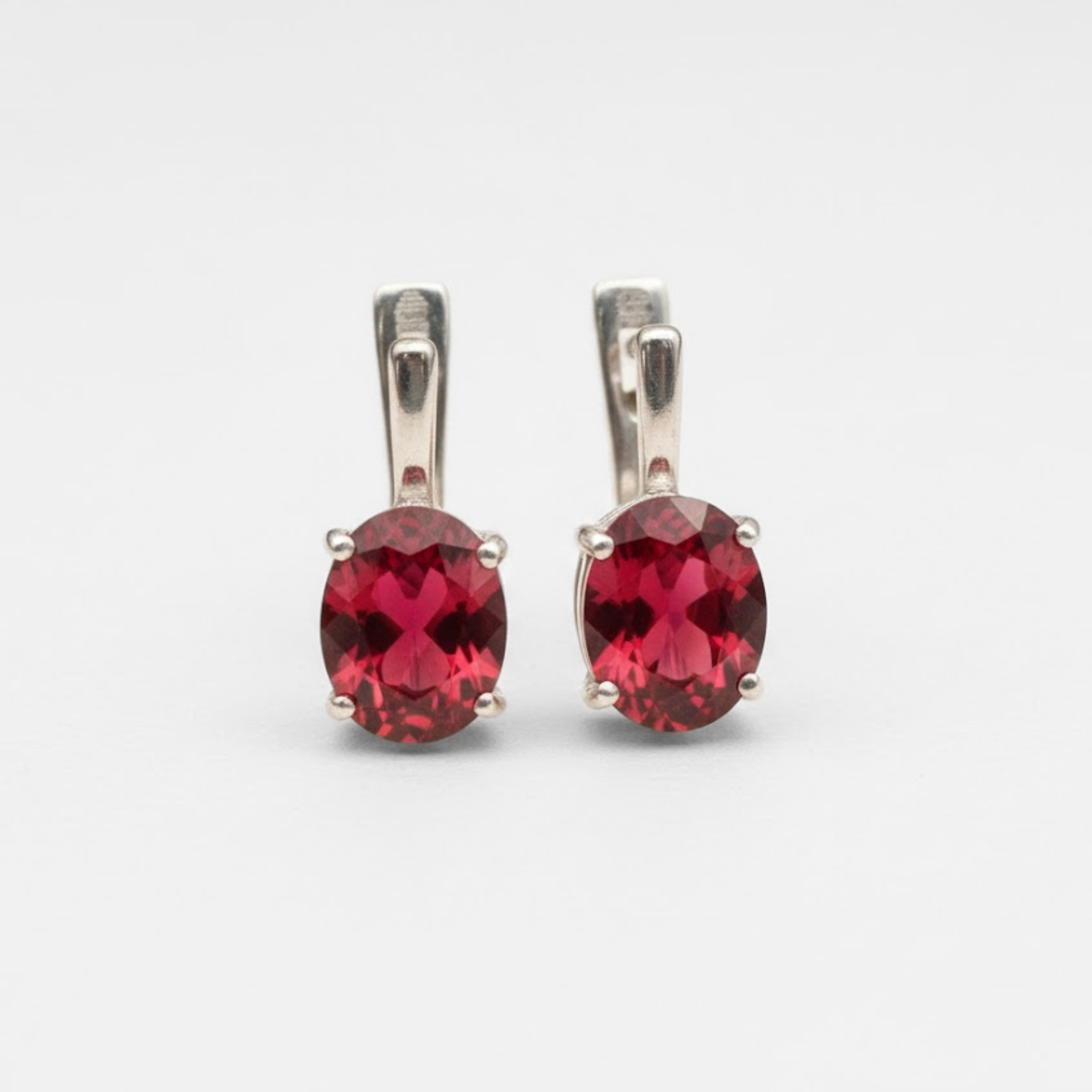 Created Ruby Earrings made in 925 Sterling Silver with Oval Created Red Ruby in Prong setting, July Birthstone gift idea, symbolizes nobility, purity, and passion, ideal for everyday wear and perfect for birthday gifting and special occasions.
