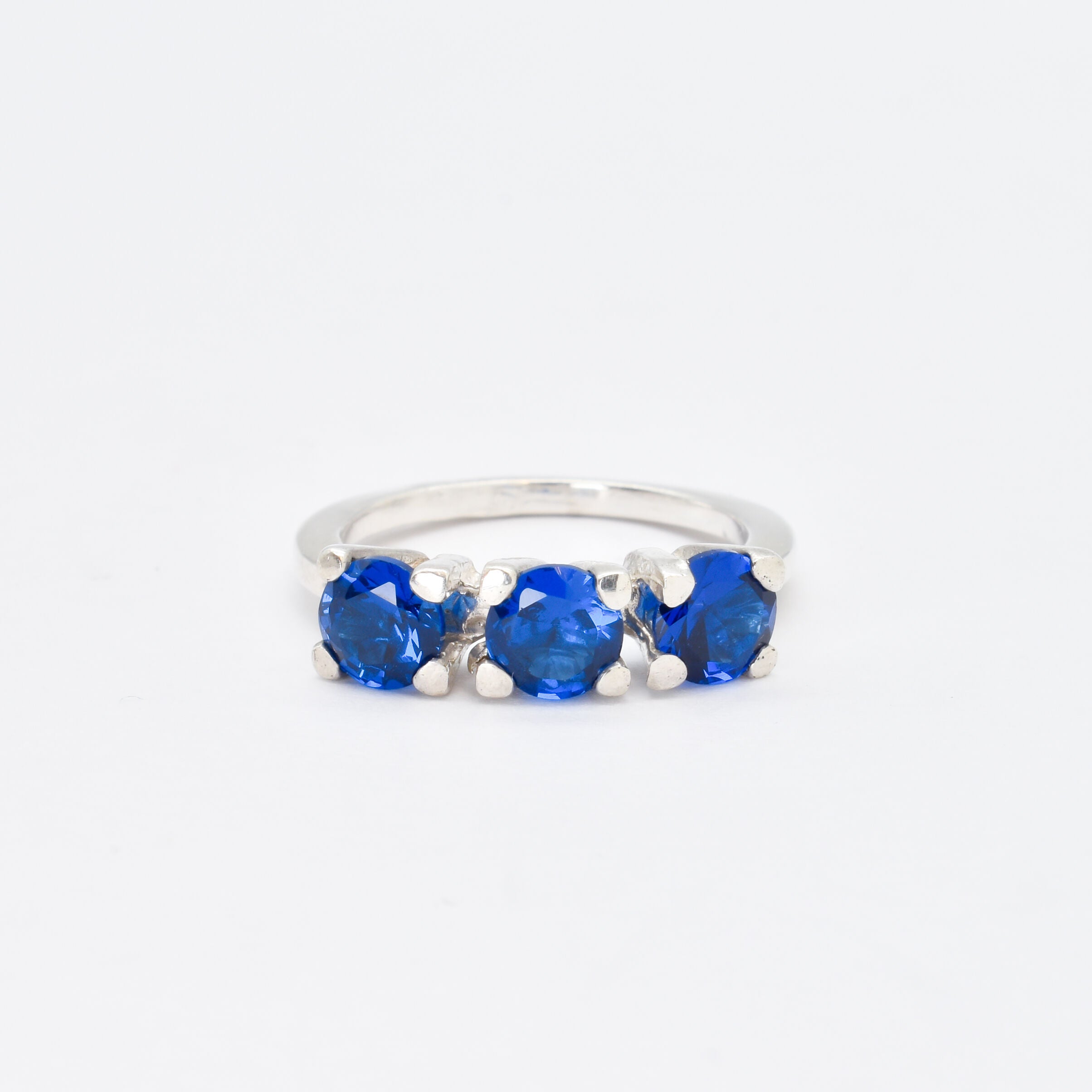 Created Sapphire Ring made in 925 Sterling Silver with Round Created Blue Sapphire in Three-Stone setting, September Birthstone gift idea, symbolizes sincerity, truth, and faithfulness, ideal for everyday wear and perfect for birthday gifting and special occasions.