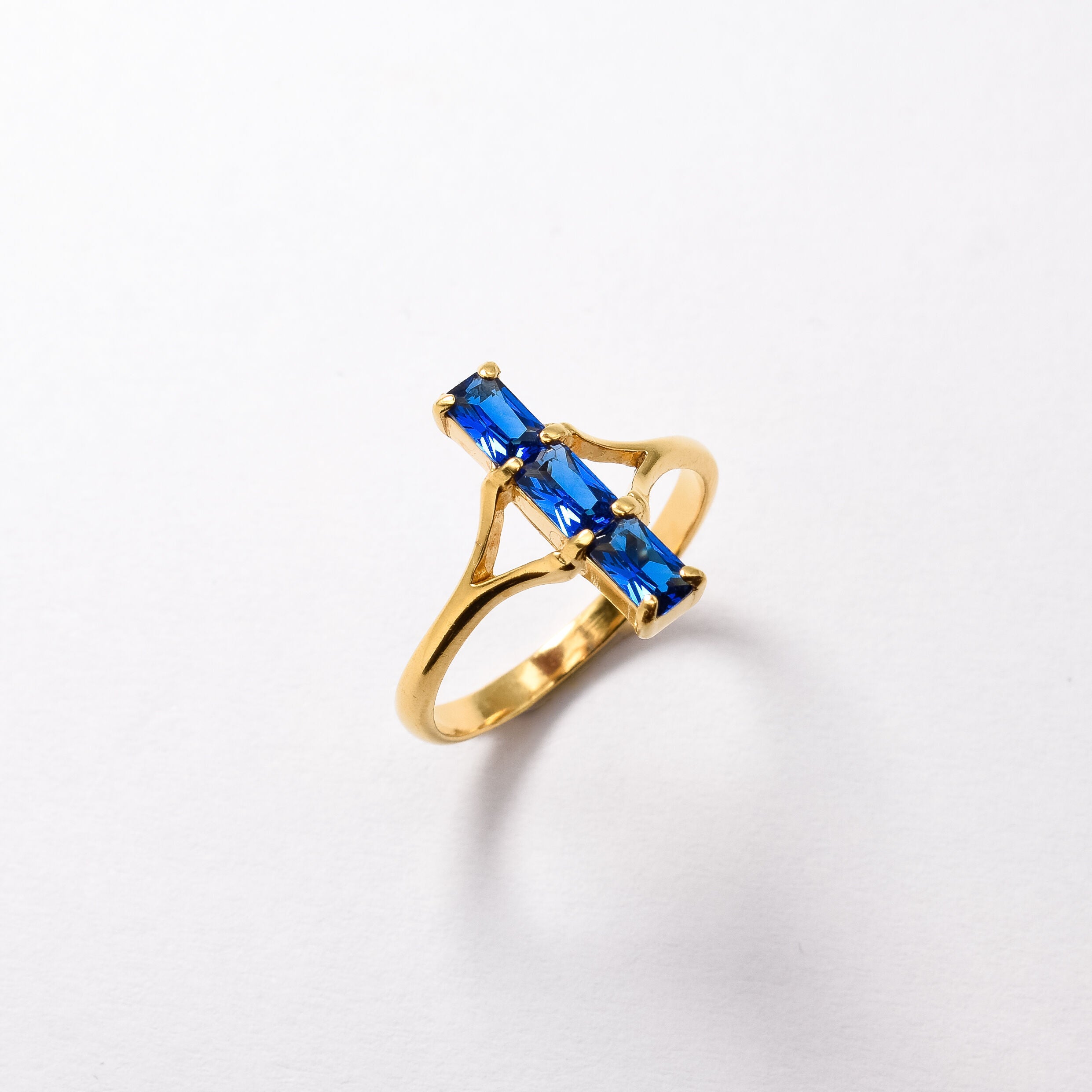 Created Sapphire Ring made in 18k Gold Vermeil with Baguette Created Blue Sapphire in Three-Stone setting, September Birthstone gift idea, symbolizes sincerity, truth, and faithfulness, ideal for everyday wear and perfect for birthday gifting and special occasions.