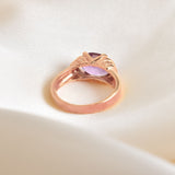 back angled view of rose gold ring with natural amethyst gemstone and diamond cut clarity
