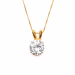 18k Yellow gold plated pendant with Diamond April birthstone in diamond and prong setting. Solitaire necklace ideal for special occasions and everyday wear. Round diamond necklace symbolizing eternal love, purity, and inner strength. Can be styled as elegant wedding necklace.