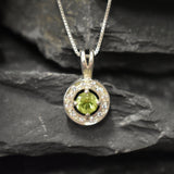 Round Peridot and CZ pendant on silver chain, elegant yet subtle style that supports emotional renewal, ideal for anniversaries or personal milestones.