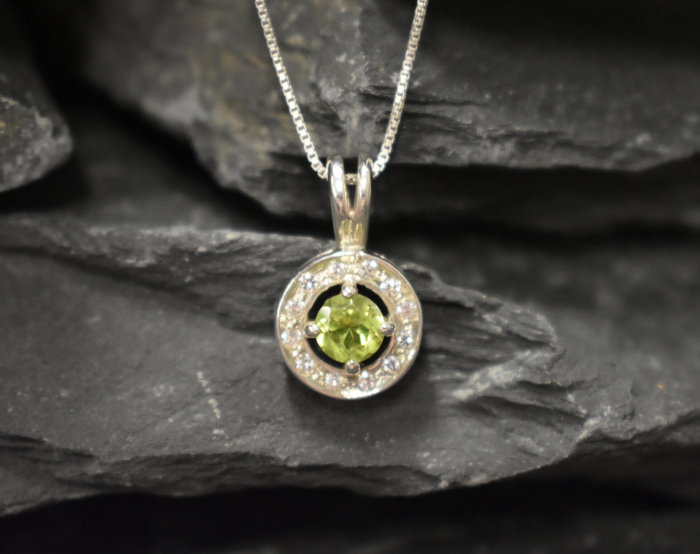 Round Peridot and CZ pendant on silver chain, elegant yet subtle style that supports emotional renewal, ideal for anniversaries or personal milestones.