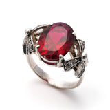 Created Ruby Ring made in 925 Sterling Silver with Oval Created Red Ruby in Solitaire with Accents setting, July Birthstone gift idea, symbolizes nobility, purity, and passion, ideal for everyday wear and perfect for birthday gifting and special occasions.