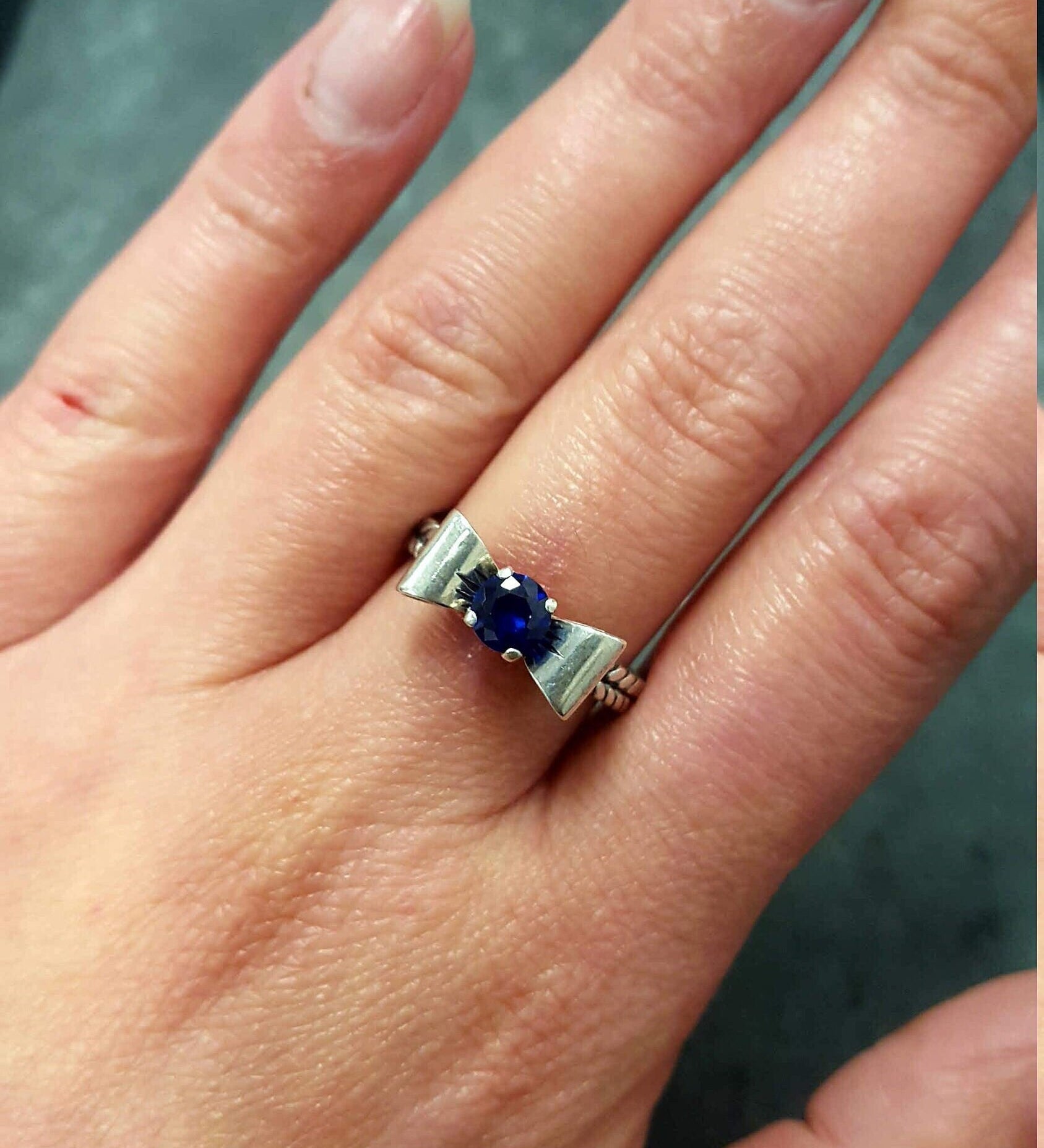 Elegant Created Sapphire Ring in 925 Sterling Silver, featuring a round blue sapphire, perfect for birthdays and special occasions.