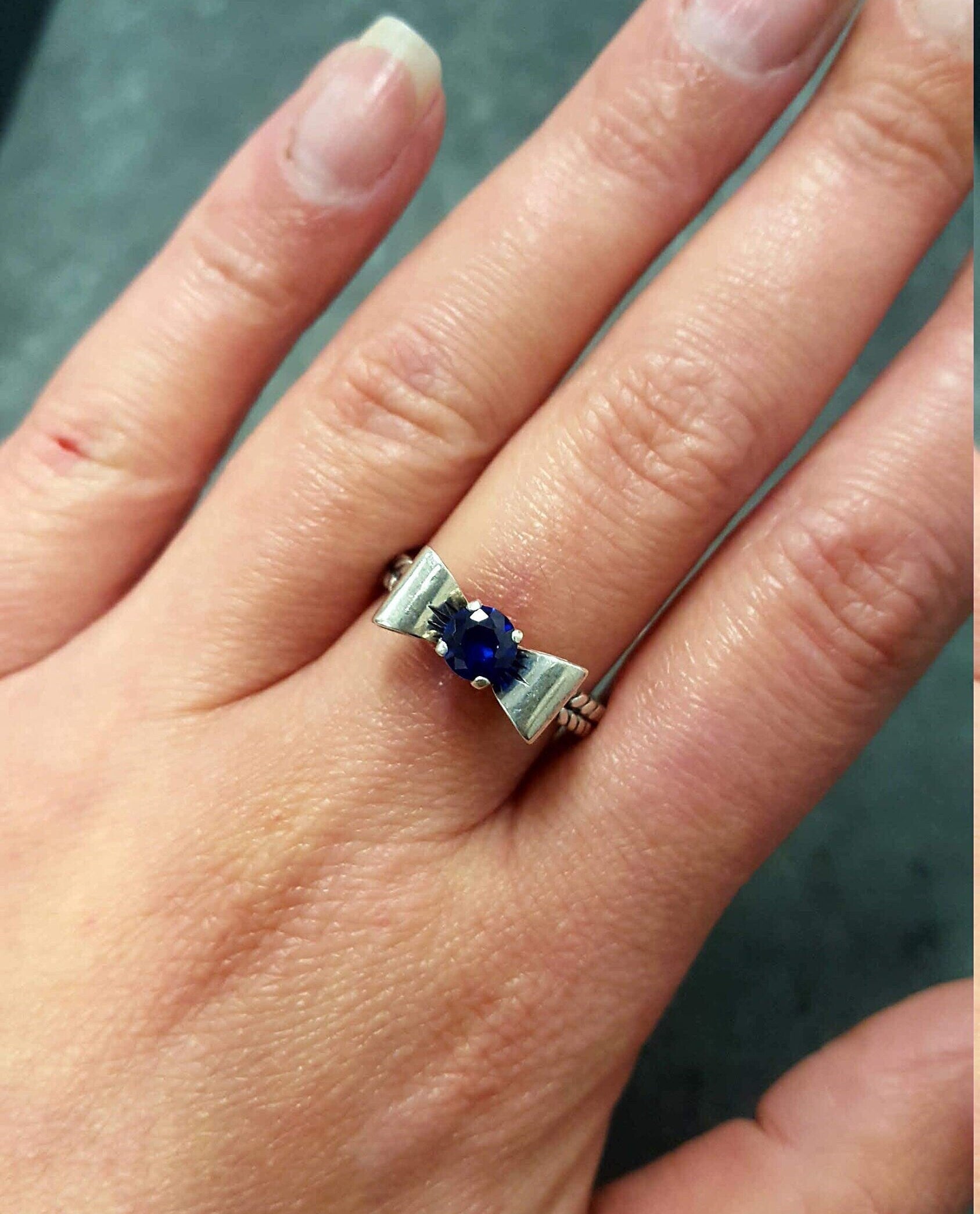 Elegant Created Sapphire Ring in 925 Sterling Silver, featuring a round blue sapphire, perfect for birthdays and special occasions.