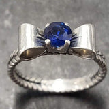 Charming created sapphire ring in 925 sterling silver with a radiant blue stone, ideal for everyday elegance and special gifts.