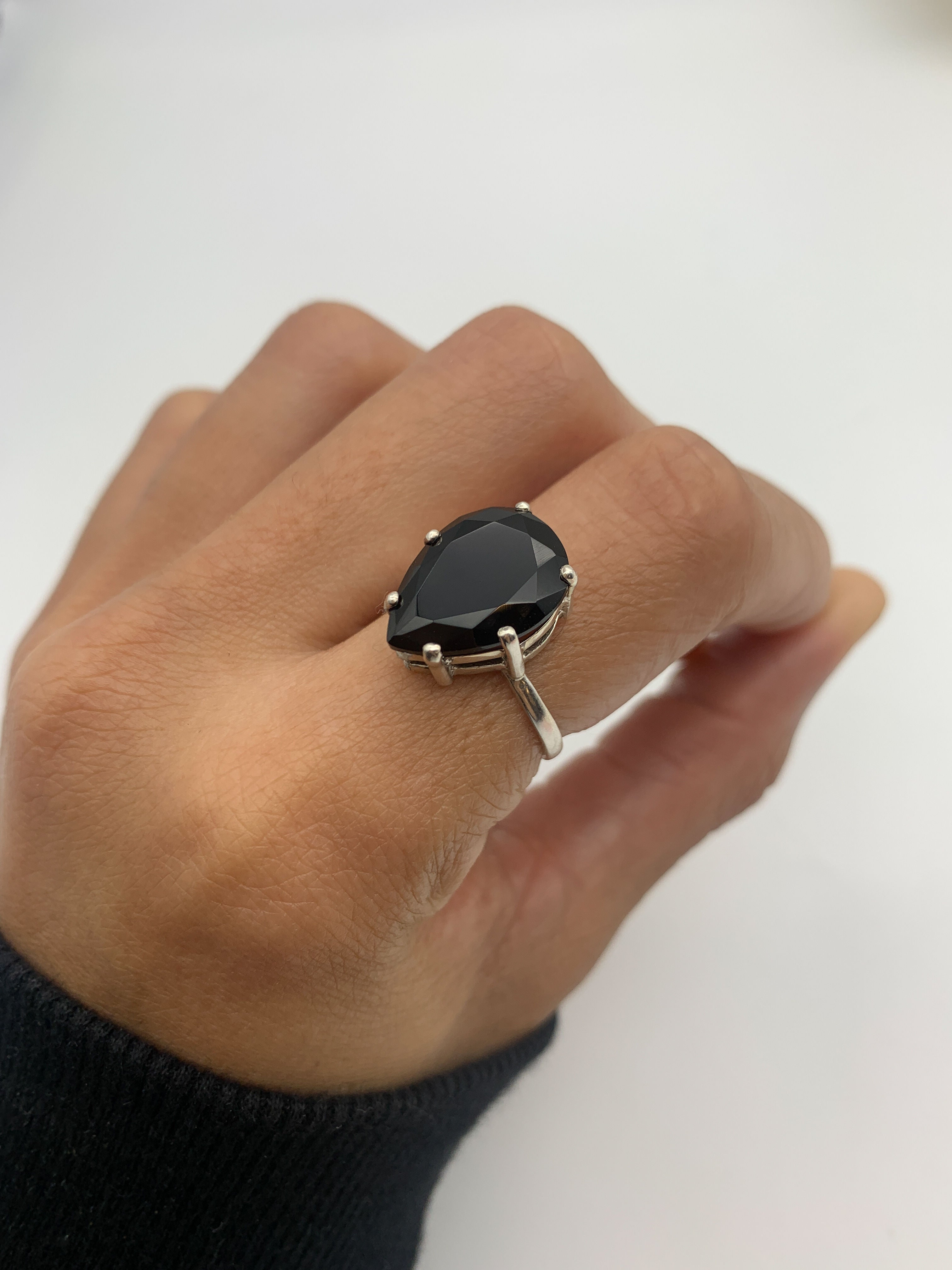 This Onyx Ring offers timeless style and symbolic grounding.
