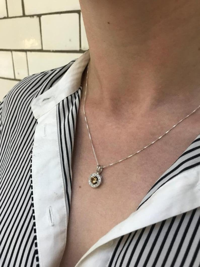 Natural Peridot Pendant Necklace layered over soft neckline, combining real gemstone beauty with versatile styling for spring gifting, anniversaries, or Sunday brunch wear.