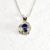 Tanzanite Flower Necklace set in Solid 925 Sterling Silver, in a round cut, stunning blue color, and prong setting. December birthstone pendant that promotes spiritual awakening, ideal for everyday wear, and for casual and chic style