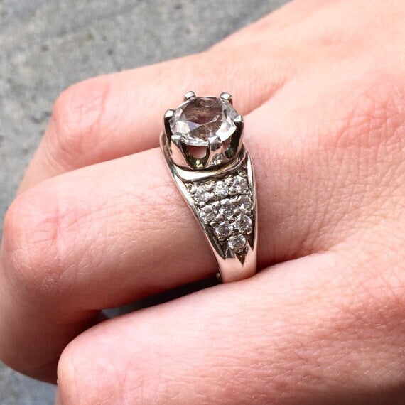 Smoky Topaz ring worn on middle finger, paired with neutral-toned nails for a chic everyday style.